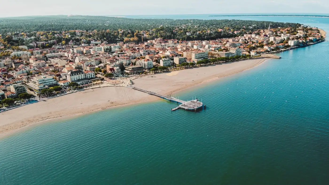 Scenic aerial view of Arcachon's beachfront and town, capturing the vibrant coastline of Nouvelle-Aquitaine, France.