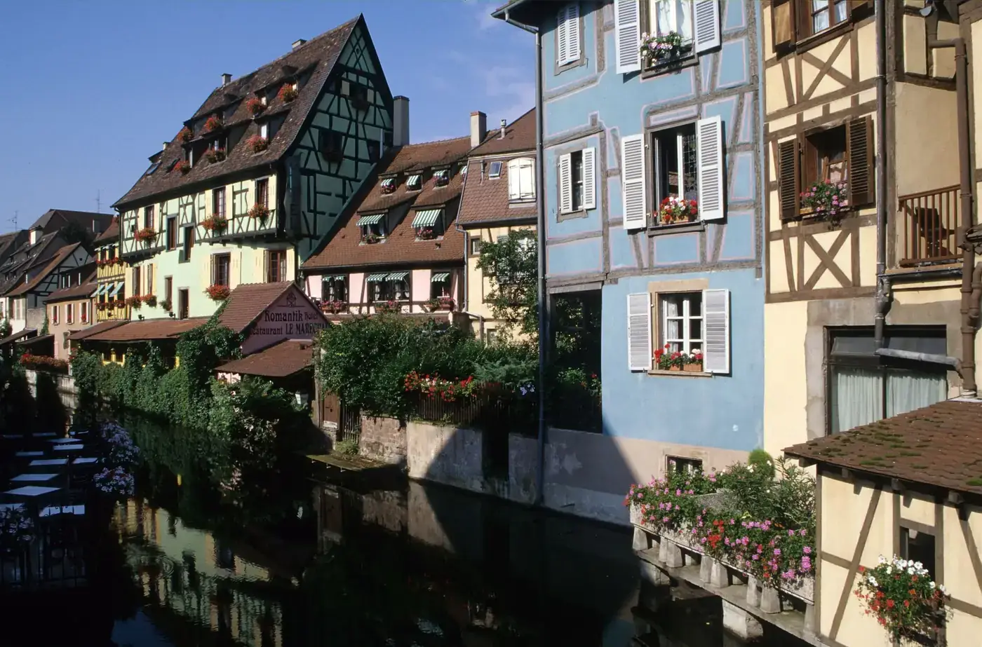 Quaint canal-side houses in La Petite Venise, Colmar, France. A picturesque tourist destination.