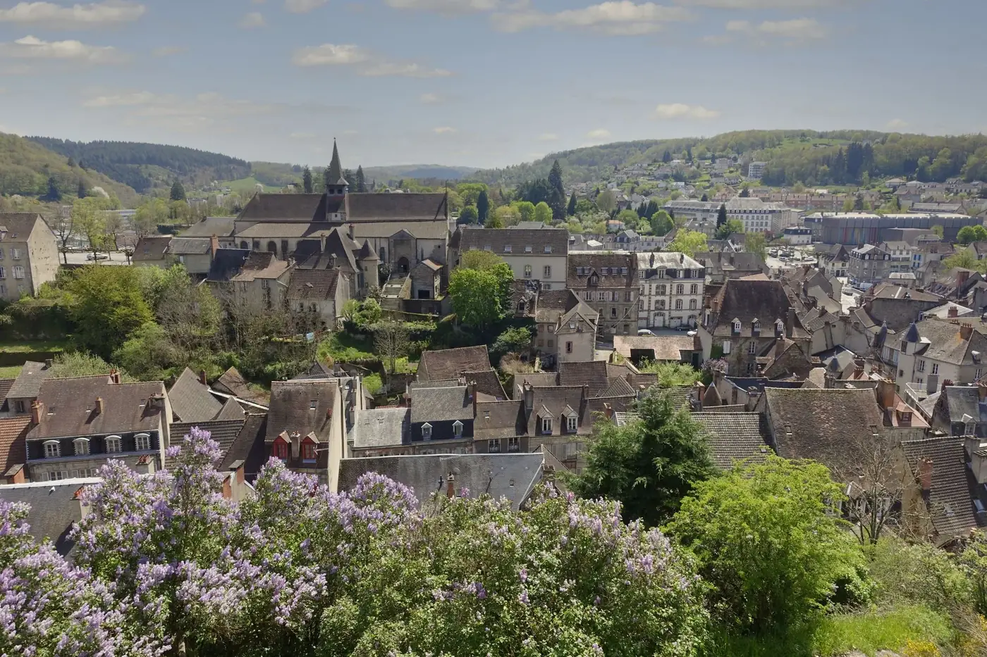 Scenic view of a charming French village with blooming flowers in springtime.