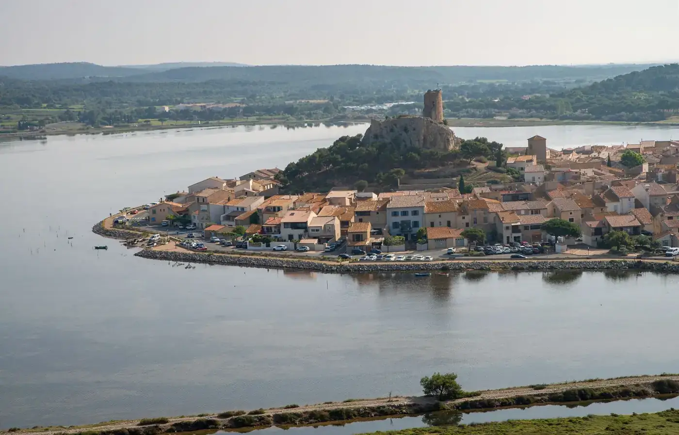 Scenic aerial view of historic Gruissan village by the lake in Occitanie, France.