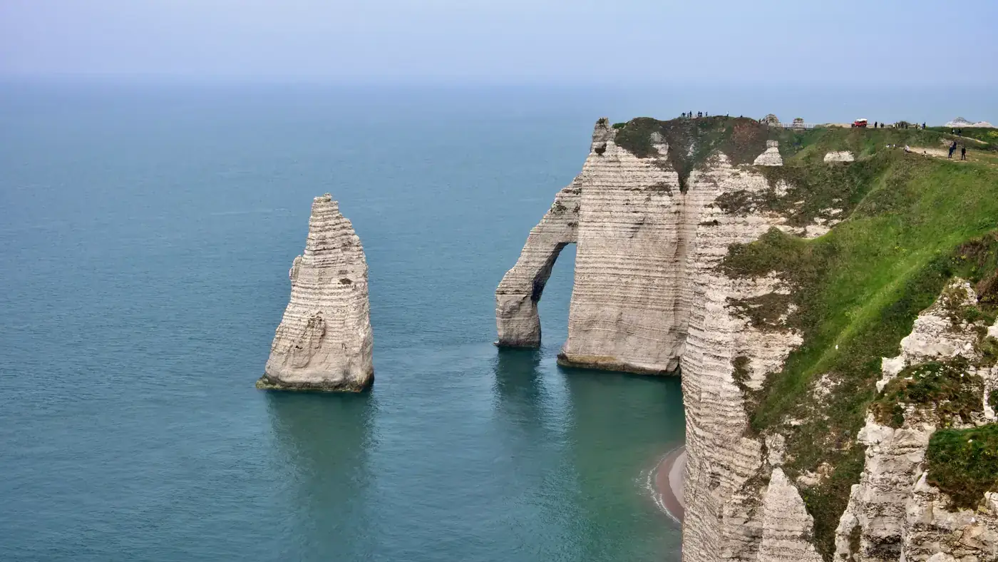 Breathtaking view of the iconic limestone cliffs at Étretat, Normandy, France.