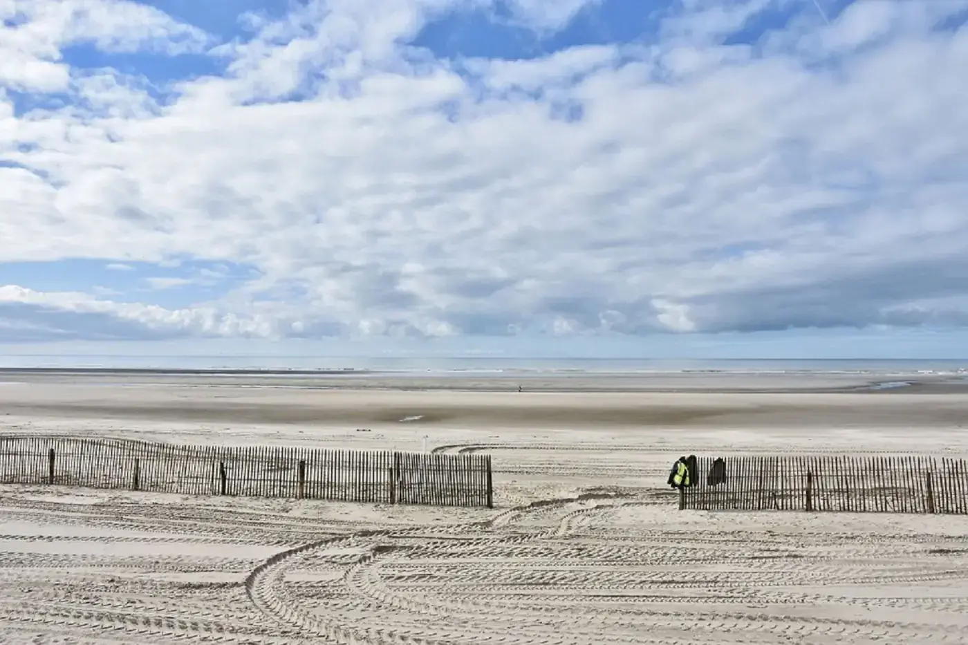 Beautiful sandy beach with cloudy sky at Le Touquet-Paris-Plage in France.