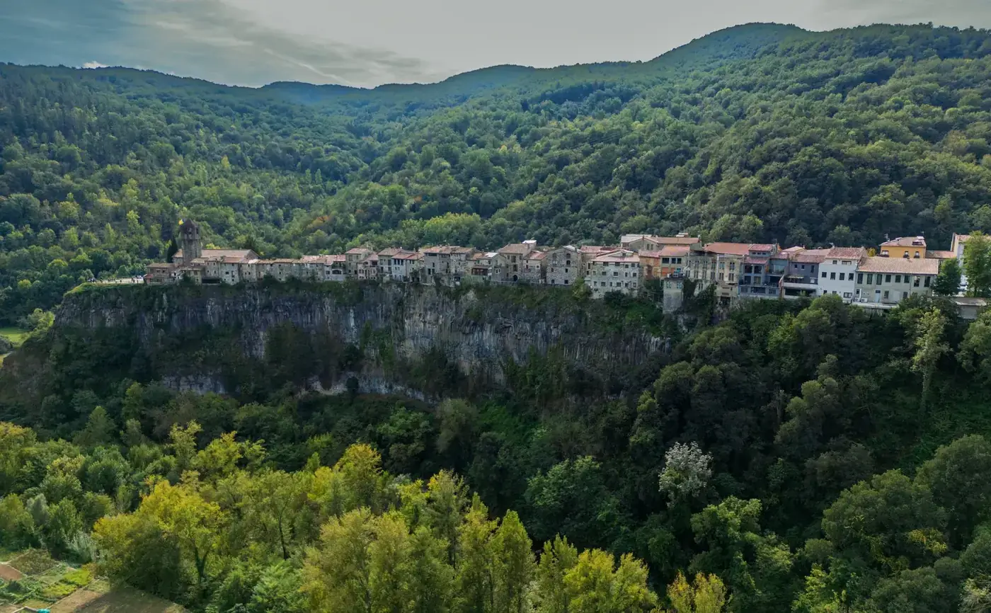 Breathtaking aerial view of Castellfollit de la Roca, a picturesque village perched on a cliff in Spain's Catalonia regi