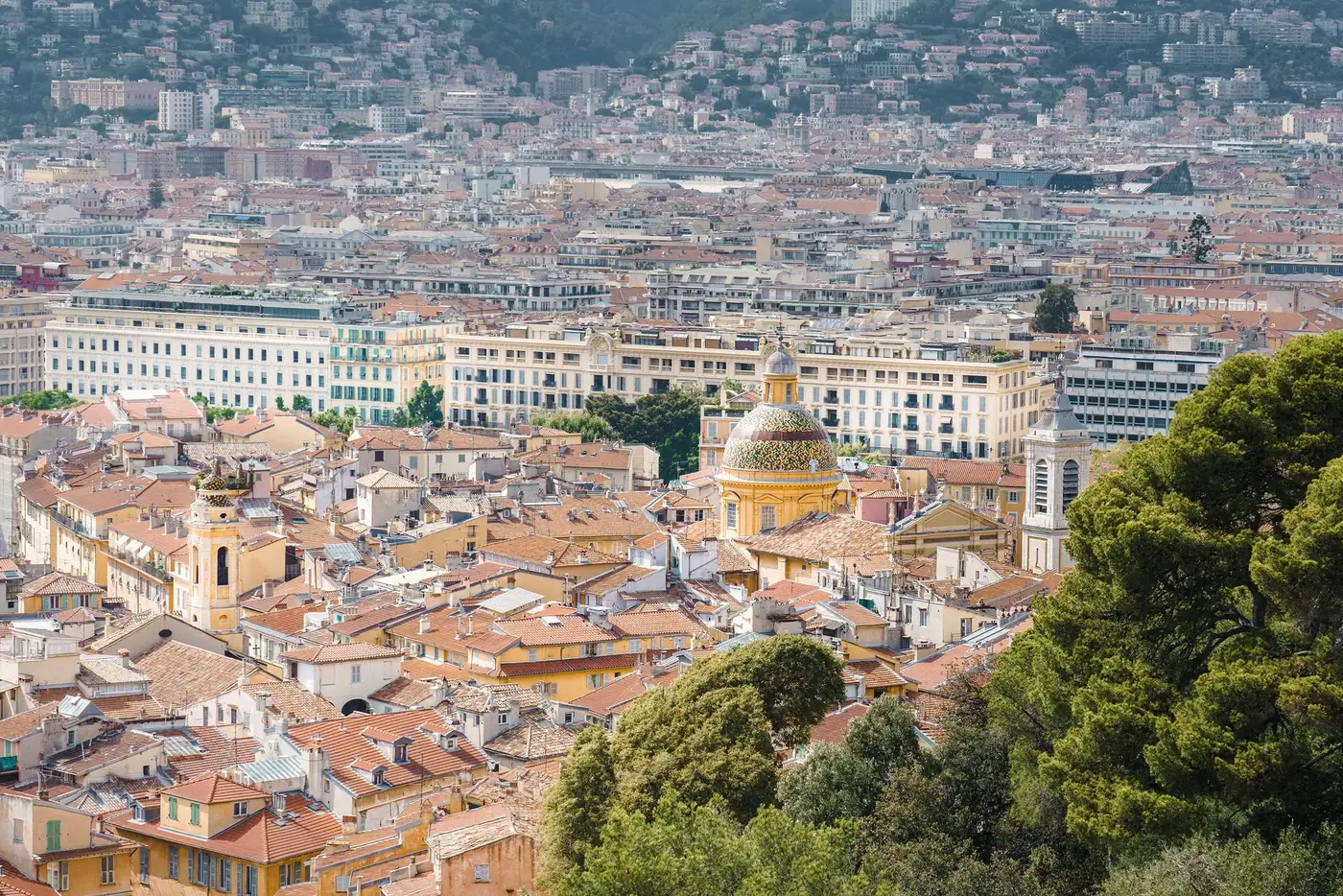 Explore the charming architecture and vibrant rooftops of Old Town Nice from above. Perfect for travel enthusiasts.