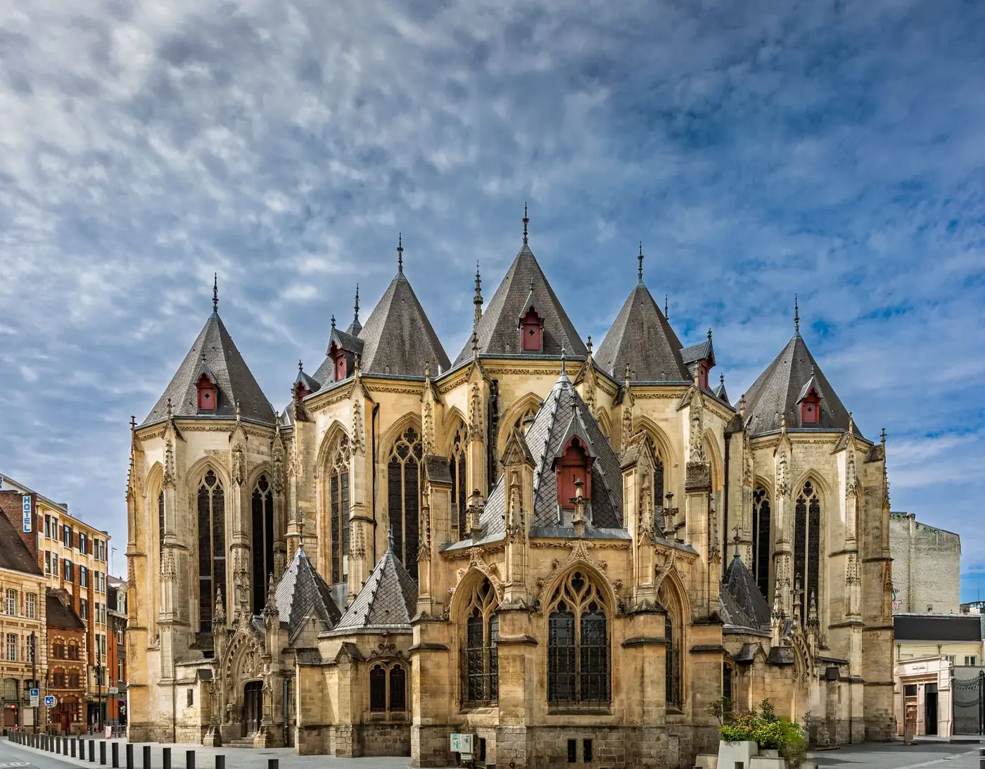 Elegant Gothic architecture of Saint-Maurice Church in Lille, France under a vibrant sky.