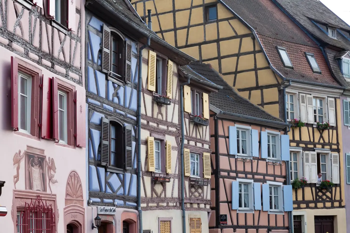 Colorful half-timbered buildings in Colmar, France capture historic European architecture.